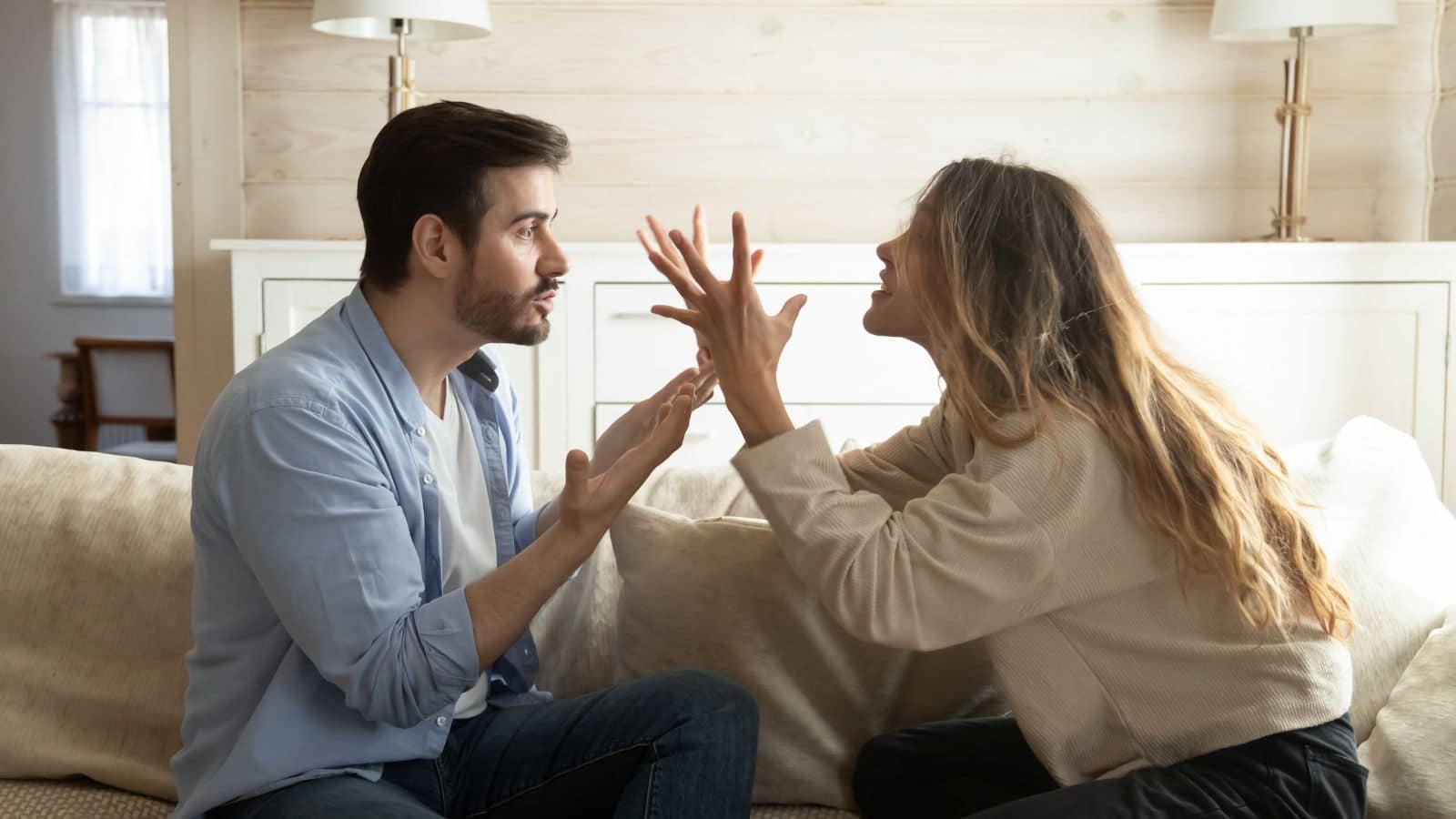 couple fighting on the couch