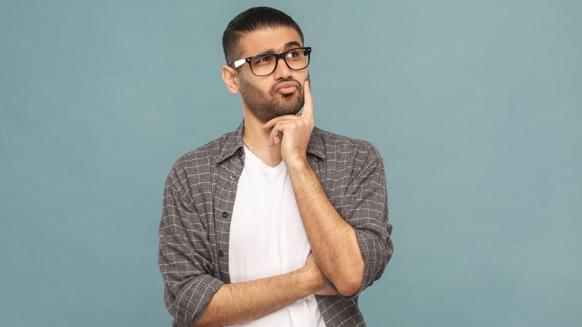 man thinking with hand on his chin